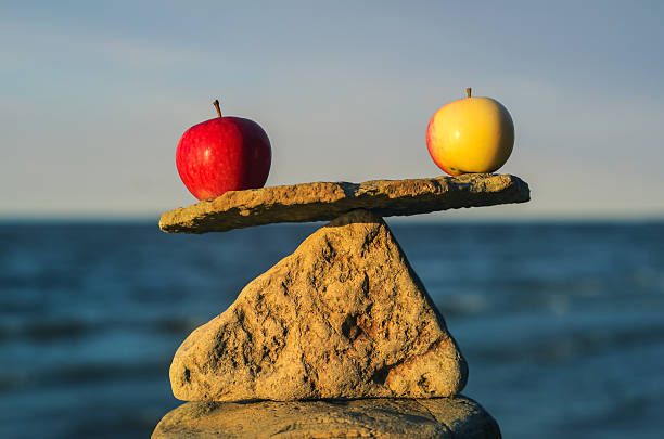 Balancing of apples stock photo