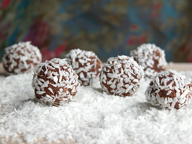 A ball of chocolates covered in coconuts stock photo