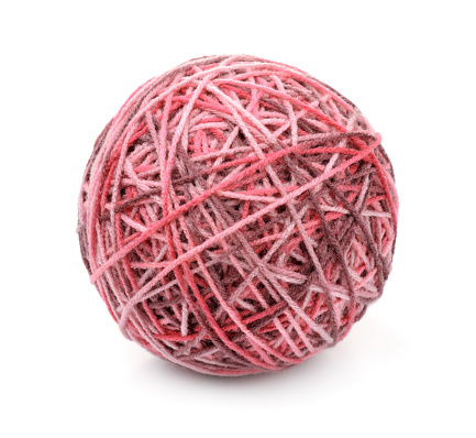 Top view of knitting with needles and yarn ball isolated on white