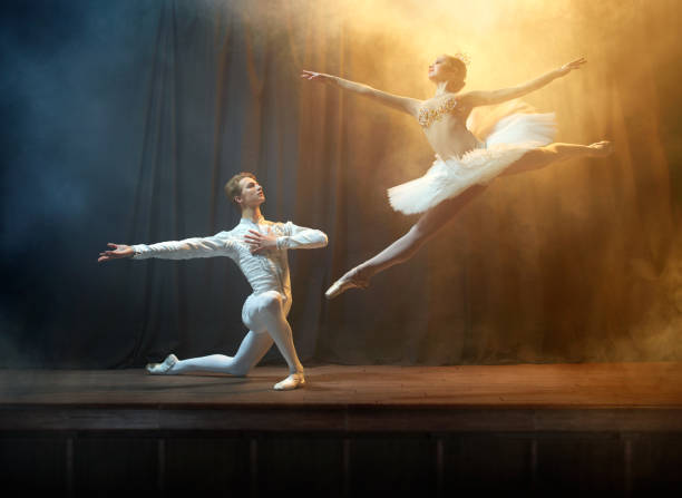 Ballet Dancers Performing On Stage In Theatre