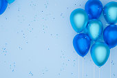 istock balloons of blue color, blue background.3D illustration. 1334513598
