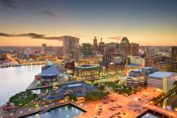Baltimore Maryland Skyline Baltimore, Maryland, USA inner harbor and downtown skyline at dusk. baltimore maryland stock pictures, royalty-free photos & images