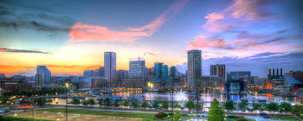 Baltimore, MD Sunset at the Inner Harbor in Baltimore, MD baltimore maryland stock pictures, royalty-free photos & images