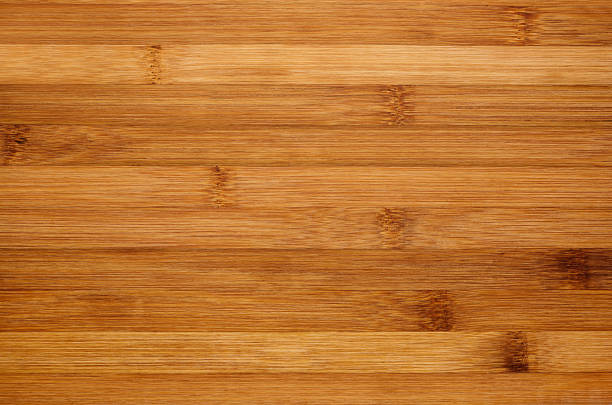 Bamboo brown wood texture, horizontal plank, top view, closeup. Bamboo brown wood texture, horizontal plank, top view, closeup. bamboo material stock pictures, royalty-free photos & images