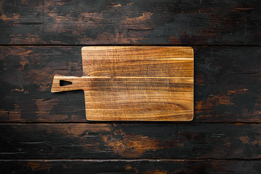 Bamboo kitchen cutting board set empty for empty for copy space for text or food, top view flat lay, on old dark  wooden table background