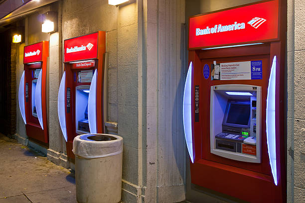 Bank of America ATM Machines In Lower Class Area "Los Angeles, USA - November 9, 2011: Three Bank of America ATM machines located in a poor area of the city in Los Angeles on November 9, 2011." bank of america stock pictures, royalty-free photos & images