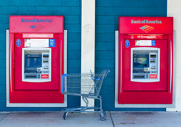 Sacramento, USA - September 23, 2013: Bank of America ATMs. Sacramento, USA - September 23, 2013: Bank of America ATMs on September 23, 2013 in Sacramento, California. The Bank of America Corporation is an American multinational banking and financial services corporation. bank of america stock pictures, royalty-free photos & images