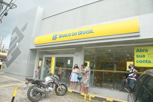salvador, bahia, brazil - november 24, 2021: People are seen queuing to enter a Banco do Brasil bank branch in the city of Salvador.