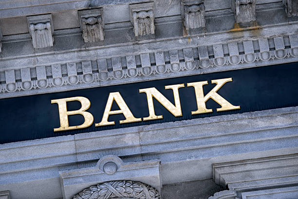 Bank sign on a building exterior. An old fashioned 'Bank' sign on a building exterior. bank financial building stock pictures, royalty-free photos & images