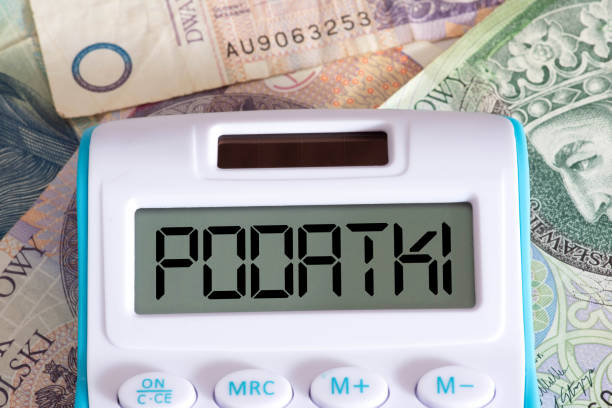 Banknotes Polish Zloty PLN, calculators and taxes in Poland stock photo