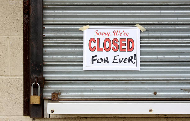 Bankrupt Business with a closed forever sign on the door stock photo