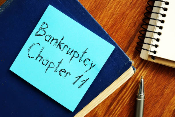 Bankruptcy Chapter 11 is shown on the conceptual business photo stock photo