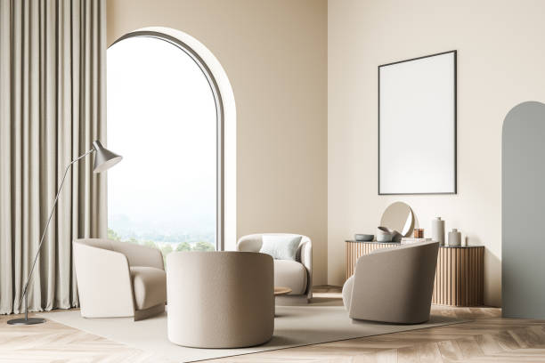 Banner in the beige living room with arch window and four armchairs stock photo