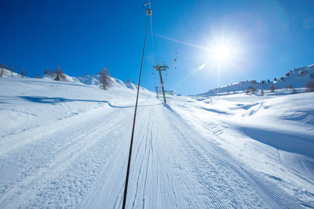 T bar ski lift in European Alps T bar ski lift for pulling skiers up the slope. Perfect winter landscape in European Alps Italy Cortina d'Ampezzo Col Gallina t bar ski lift stock pictures, royalty-free photos & images