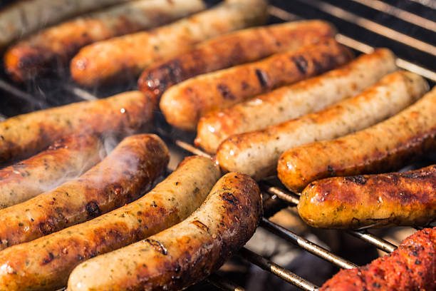 Barbecue barbecue in Germany with sausages, steaks and potatoe salad sausage stock pictures, royalty-free photos & images