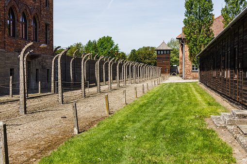 Barbed wire and watchtower around the Auschwitz-Birkenau concentration camp. Oswiecim, Poland, 16 May 2022.