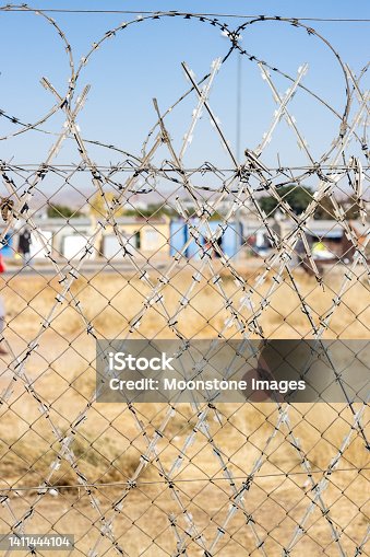 istock Barbed Wire at Katutura Township near Windhoek in Khomas Region, Namibia 1411444104