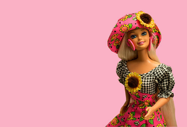 barbie toy doll isolated on pink background. - barbie stockfoto's en -beelden