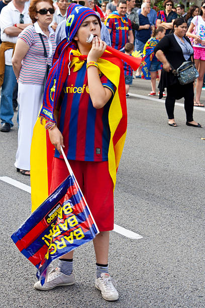 Barcelona fans Barcelona, Spain - May 29, 2011. Kid celebrates the victory of the Champions League of his team in catalunya square. messi stock pictures, royalty-free photos & images