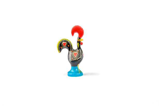 Barcelos Portuguese colorfully painted rooster - Center page view. A ceramic Barcelos Portuguese rooster is captured on a white background. The rooster casts a small shadow.  Copy space. barcelos stock pictures, royalty-free photos & images