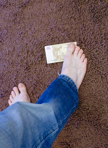 barefoot money stock photo