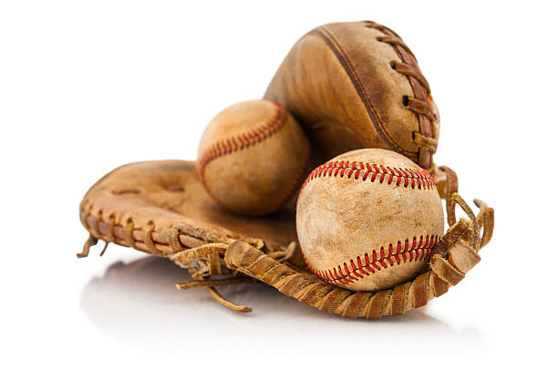 Broken catcher mitt with pair of baseball balls