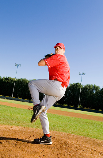 Baseball Pitcher Throwing A Pitch Stock Photo - Download Image Now - iStock