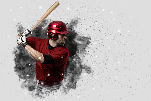 Baseball Player Baseball Player with a red uniform coming out of a blast of smoke . home run stock pictures, royalty-free photos & images