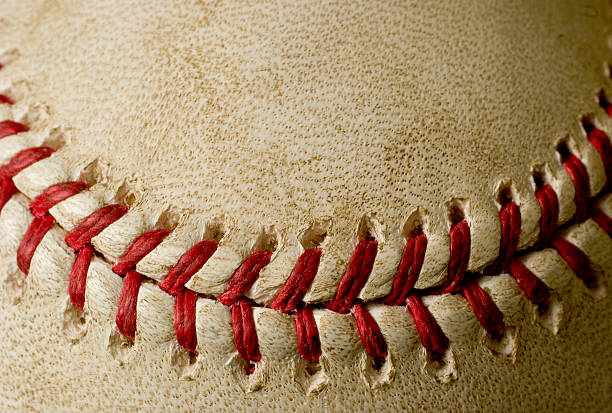Baseball Smile A closeup shot of baseball stitching in the shape of a smile. For all the happy baseball fans out there. Thanks for checking it out! home run stock pictures, royalty-free photos & images