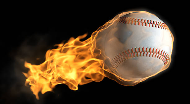 A baseball with a tail of flames A base ball that is on fire flying through the air. home run stock pictures, royalty-free photos & images