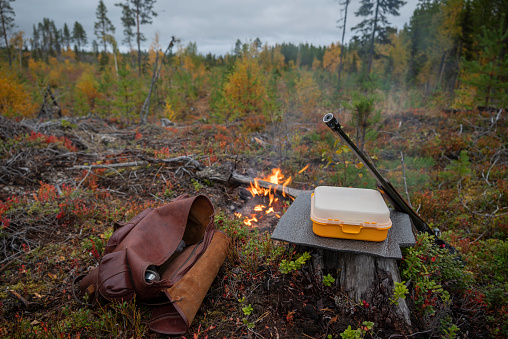 The most important for the moose hunter, weapon, butt insulation, fire, box of sandwiches and a backpacker with a thermos with coffee, picture from the north of sweden.