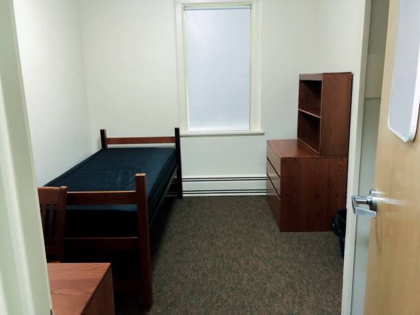 Basic Nondescript Undecorated White Box Dorm Room Standard college/university/boarding student dormitory room. college dorm stock pictures, royalty-free photos & images