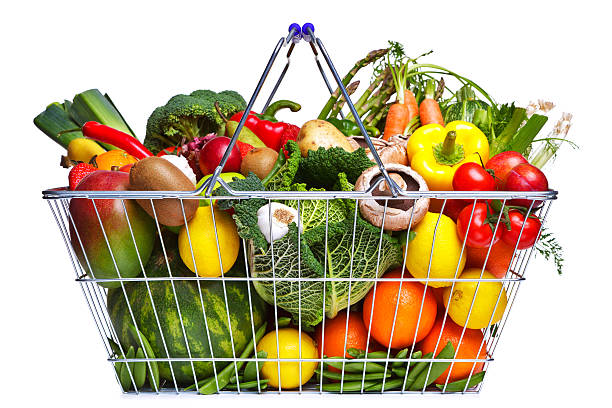 A basket filled with fruits and vegetables stock photo