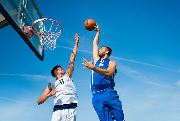 Basketball action in mid air stock photo