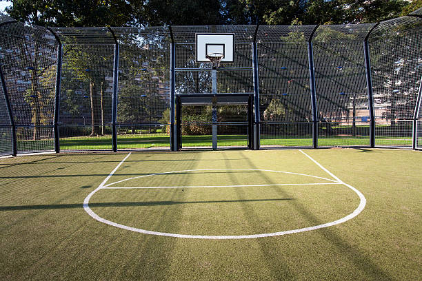 Basketball and soccer cage Basketball and soccer cage with artificial turf anchor point stock pictures, royalty-free photos & images