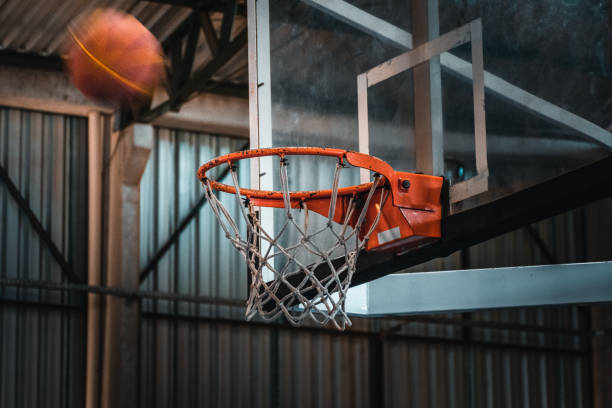 Basketball ball and basket stock photo
