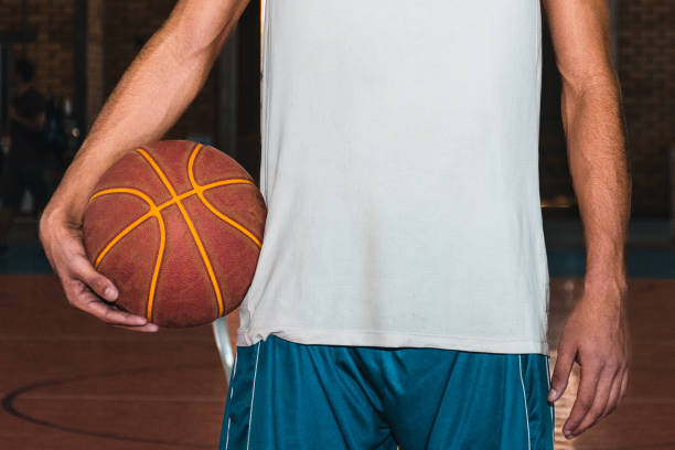 Basketball player holding a ball stock photo