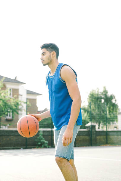 Basketball Player On The Court, Bouncing Basketball player on the court, bouncing. fulham stock pictures, royalty-free photos & images