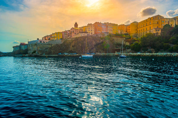 Bastia old city center, lighthouse and harbour. Bastia old city center against setting sun, lighthouse and harbour. Bastia is second biggest town on Corsica, France, Europe. bastia stock pictures, royalty-free photos & images