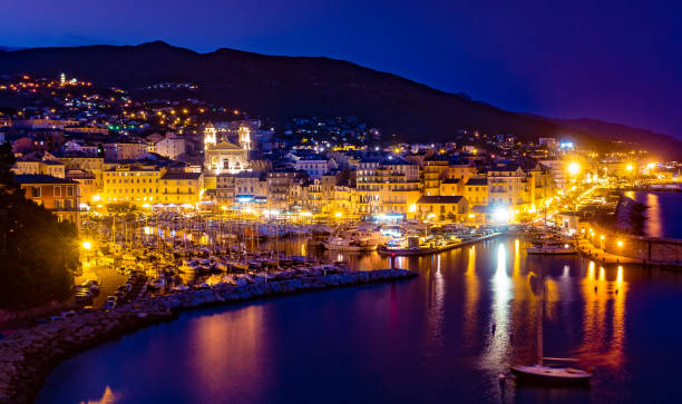 Bastia old city center, lighthouse and harbour. Bastia old city center at night, lighthouse and harbour. Bastia is second biggest town on Corsica, France, Europe. bastia stock pictures, royalty-free photos & images