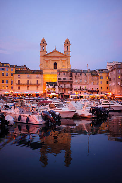 Bastia Old Port Bastia, France - October 15, 2014: Scene of the old port (the Vieux Port) at sunset, in Bastia, Corsica, France. Bastia is the biggest city in Corsica bastia stock pictures, royalty-free photos & images