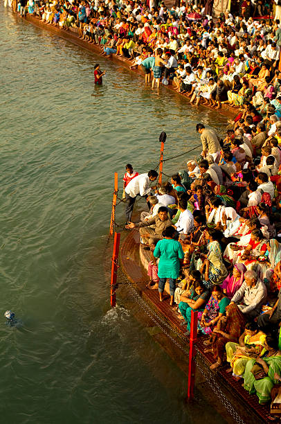 bathing in ganges river stock photo
