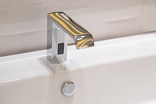 Bathroom faucet in polished chrome powered automatic by sensor. object about home Improvement. stock photo