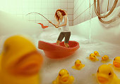 Redhead girl fishing in the bath tub lake.