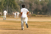 istock Batsman running going to bating on match ground 1393792334