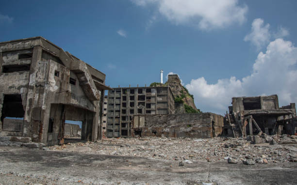 Battleship Island (Gunkanjima, Hashima, Gunkanjima, Gunkanjima, Gunkanjima) Hashima Island (端島 or simply Hashima — -shima is a Japanese suffix for island), commonly called Gunkanjima (軍艦島; meaning Battleship Island), is an abandoned island lying about 15 kilometers (9 miles) from the city of Nagasaki, in southern Japan. It is one of 505 uninhabited islands in Nagasaki Prefecture. The island's most notable features are its abandoned concrete buildings, undisturbed except by nature, and the surrounding sea wall. While the island is a symbol of the rapid industrialization of Japan, it is also a reminder of its dark history as a site of forced labor prior to and during the Second World War. mitsukejima island stock pictures, royalty-free photos & images