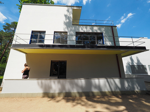 Dessau, Germany - Circa June 2019: Bauhaus masters houses designed in 1925 for Walter Gropius, Laszlo Moholy Nagy, Lyonel Feininger, Georg Muche, Oskar Schlemmer, Wassily Kandinsky and Paul Klee, some people visible