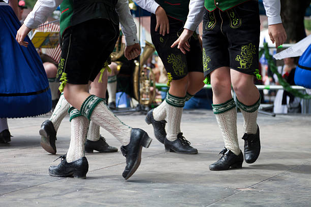 bavarian legs dancing at oktoberfest stock photo