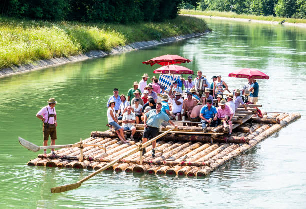bavarian raft ride ISAR, GERMANY - JULY 10: typical bavarian raft ride on the river isar, a party with tradtional music on july 10, 2013 river isar stock pictures, royalty-free photos & images