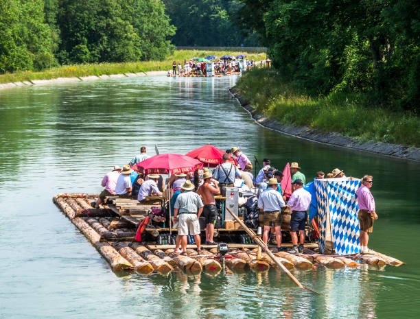 bavarian raft ride ISAR, GERMANY - JULY 10: typical bavarian raft ride on the river isar, a party with tradtional music on july 10, 2013 river isar stock pictures, royalty-free photos & images